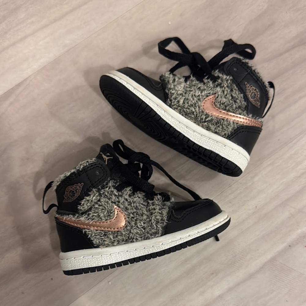 Black high-top sneakers with textured fabric and thick white sole